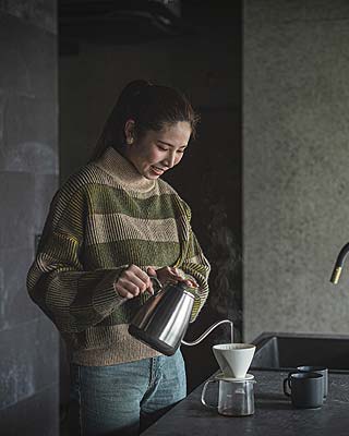 woman brewing coffee